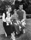 <p>June smiles with her husband, actor Dick Powell, their son Dick Jr., and daughter Pamela.</p>