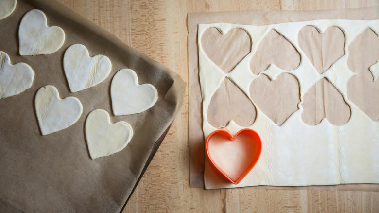 cutting heart shaped pastry pieces 