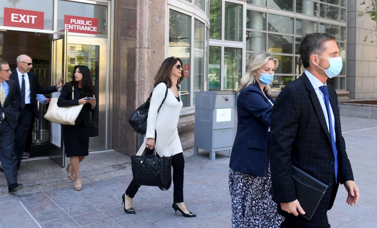 Rebecca Grossman, second from right, walks out of the Van Nuys courthouse in May 2022.