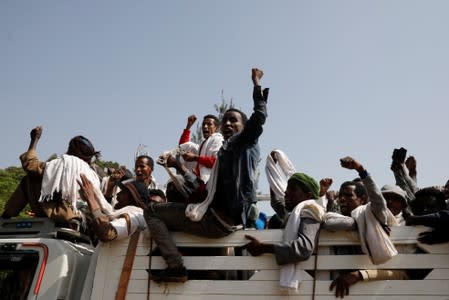 Mourners attend the funeral ceremony of Amhara president Mekonnen and two other officials who where killed in an attack in the town of Bahir Dar