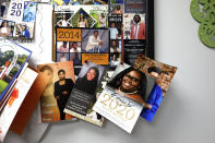 Dr. Janice Bacon's bulletin board at the Community Health Care Center on the campus of Tougaloo College is covered with senior pictures and high school graduation invitations Aug. 14, 2020, in Tougaloo, Miss. As a Black primary care physician, Bacon has created a safe space for her Black patients during the coronavirus pandemic. (AP Photo/Rogelio V. Solis)