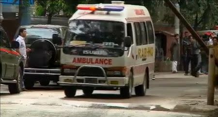 An ambulance is seen after police stormed the Holey Artisan restaurant to rescue hostages, after gunmen attacked it and took hostages early on Saturday, in Dhaka, Bangladesh in this still frame taken from video July 2, 2016. REUTERS/REUTERS TV