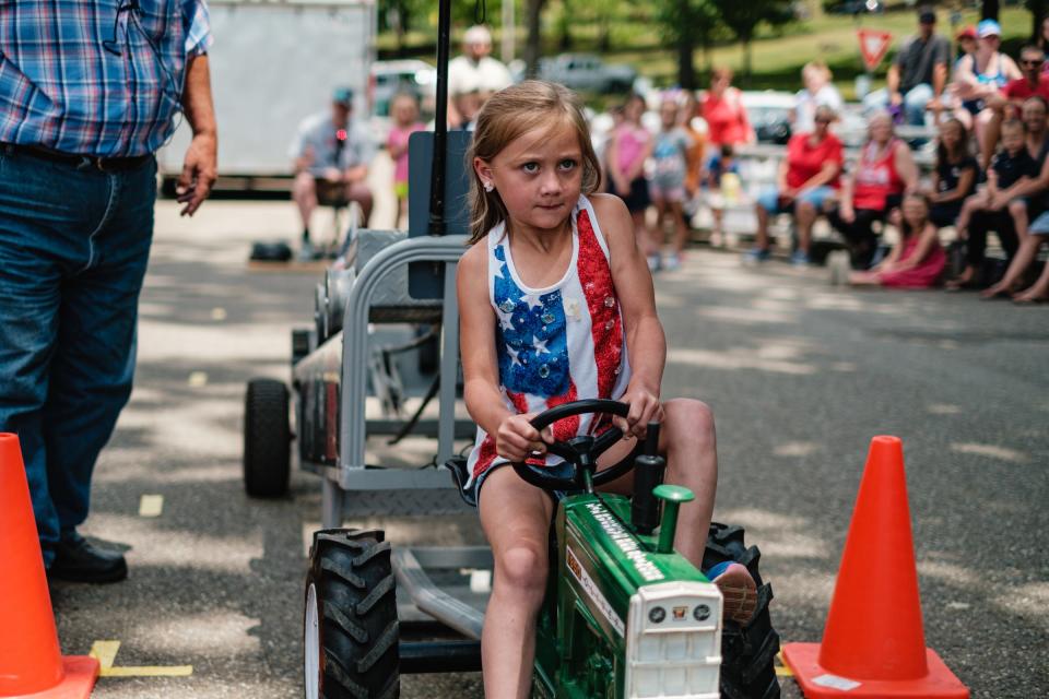 Mason Kimble, of Cadiz, competed in the pedal tractor pull during the 2021 First Town Days Festival at Tuscora Park. TIMES-REPORTER/ANDREW DOLPH