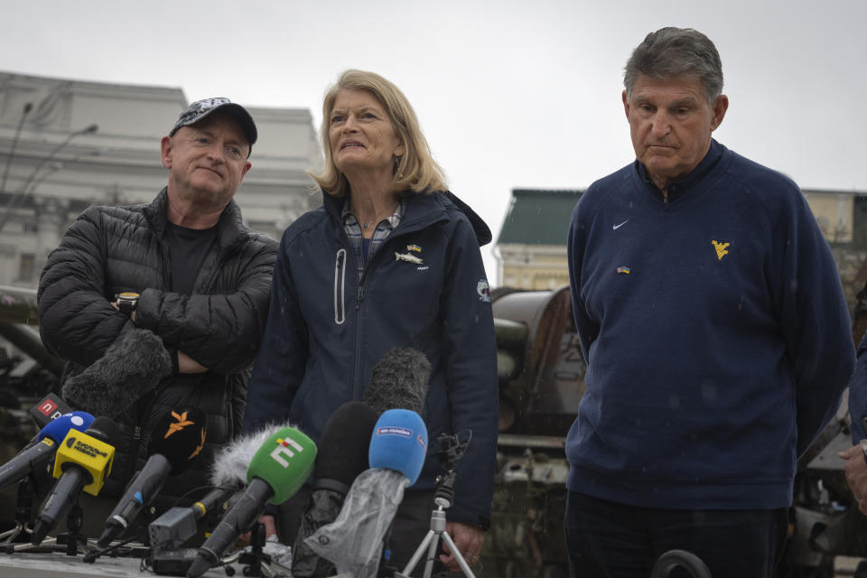 Left to right: Sen. Mark Kelly (D-Ariz.), Lisa Murkowski (R-Alaska) and US senators Joe Manchin, D-W.Va, answer media questions in Kyiv, Ukraine, Wednesday, Apr. 12, 2023. (AP Photo/Efrem Lukatsky)