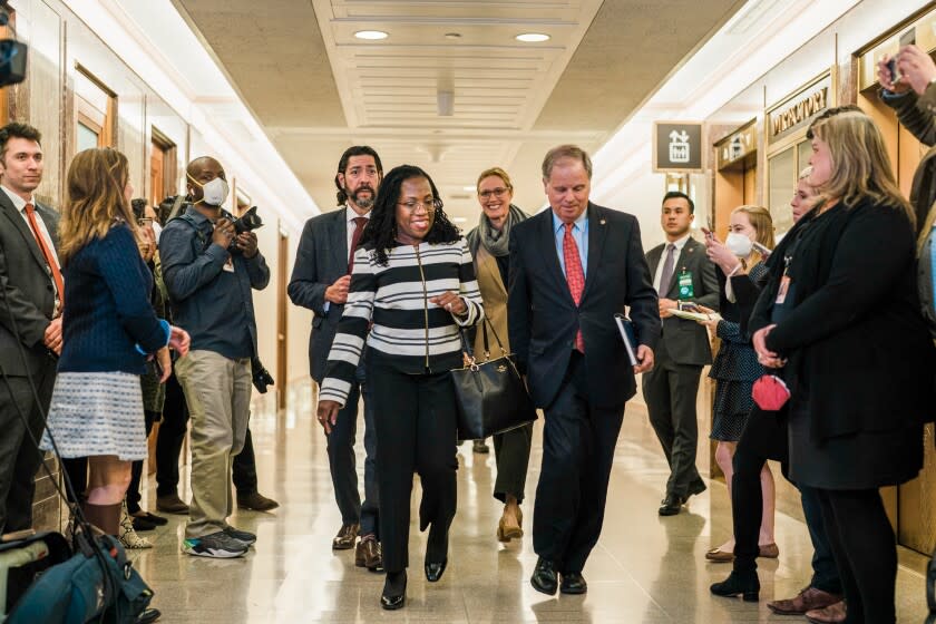 Supreme Court nominee Ketanji Brown Jackson, flanked by Former Alabama Senator Doug Jones