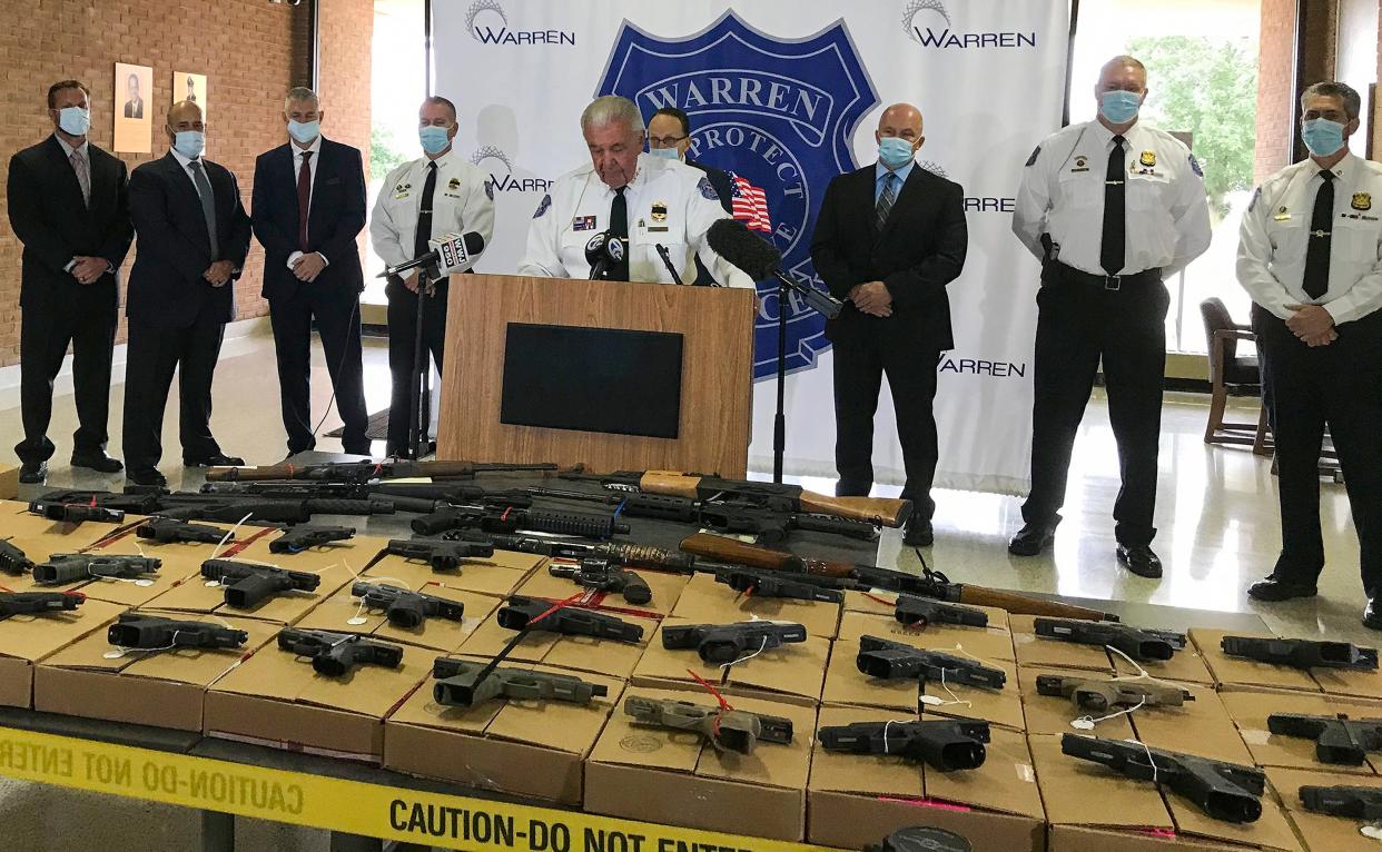 Warren Police Commissioner Bill Dwyer shows off 46 guns seized in a special effort targeting gun violence in Warren in September 2020. Dwyer said he believes such efforts are a better way to use taxpayer dollars than gun "buybacks."