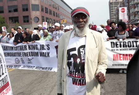 FILE PHOTO: Comedian and social activist Dick Gregory marches down Woodward Avenue during the 50th Anniversary Commemorative Freedom Walk in Detroit, Michigan June 22, 2013. REUTERS/Rebecca Cook