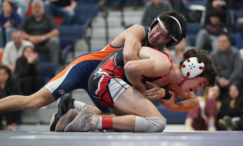 Fox Lane's Jake Long wrestles Horace Greeley's Kai Lueckerath in the 110-pound match in the quarter finals of the Section 1 Dual Meet Tournament at Horace Greeley High School in Chappaqua on Wednesday, December 14, 2022.