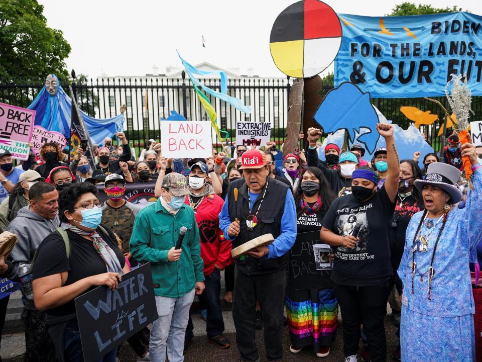 Indigenous activists march outside The White House protesting climate action