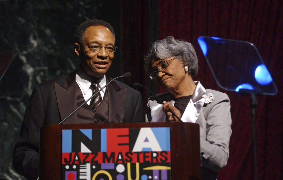 FILE - Hosts of the National Endowment for the Arts Jazz Masters Awards Concert, Ramsey Lewis, left, and Nancy Wilson announce the first NEA Jazz award of the night to Freddie Hubbard, Friday, Jan. 13, 2006, in New York. Renowned jazz pianist Lewis, whose music entertained fans over a more than 60-year career that began with the Ramsey Lewis Trio and made him one of the country’s most successful jazz musicians, died Monday, Sept. 12, 2022. He was 87. (AP Photo/Jennifer Szymaszek, File)