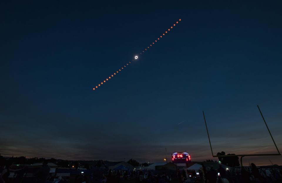 This composite view shows the progress of the total solar eclipse of Aug. 21, 2017, over Madras, Oregon. The eclipse swept across a narrow portion of the contiguous United States from Lincoln Beach, Oregon, to Charleston, South Carolina, with a partial solar eclipse visible across the entire North American continent and parts of South America, Africa and Europe. <cite>Aubrey Gemignani/NASA</cite>