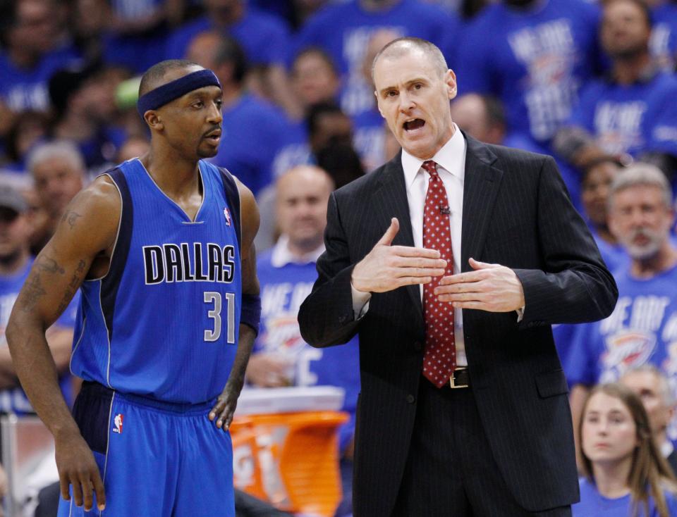 Dallas Mavericks head coach Rick Carlisle, right, talks with Jason Terry, right, in the third quarter of Game 1 in the first round of the NBA basketball playoffs, in Oklahoma City, Saturday, April 28, 2012. Oklahoma City won 99-98. (AP Photo/Sue Ogrocki)