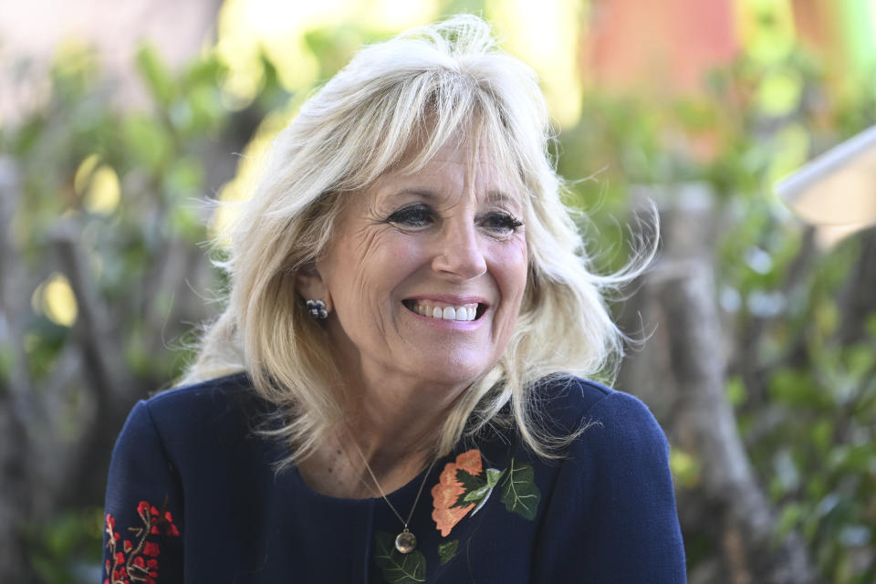 FILE - US First Lady Jill Biden smiles as she meets military surfers in Newlyn, Cornwall, England, on the sidelines of the G7 summit, Saturday June 12, 2021. The U.S. will keep alive its streak of a president never attending a British royal coronation, although first lady Jill Biden is set to attend. (Daniel Leal-Olivas/Pool via AP, File)