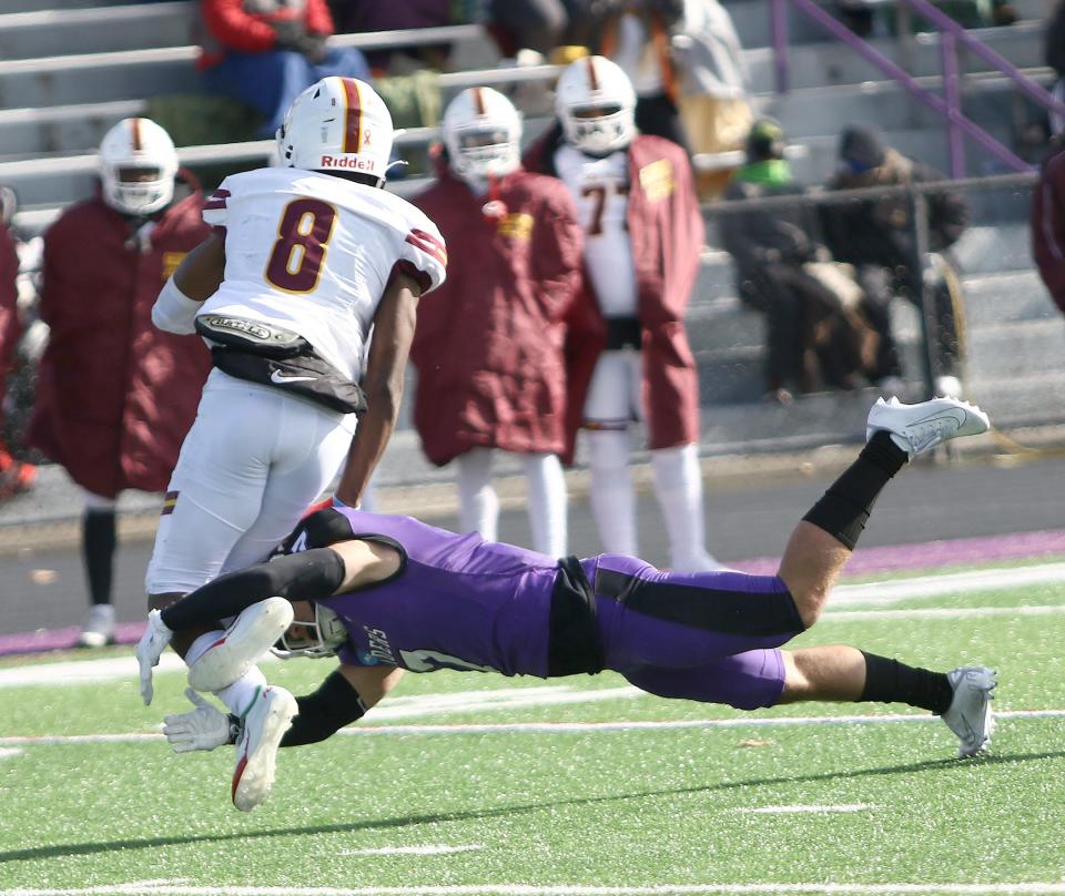 Mount Union's Jesse Vail tackles Salisbury's Dario Belizaire (8) during an NCAA playoff game at Kehres Stadium Saturday, November 19, 2022.