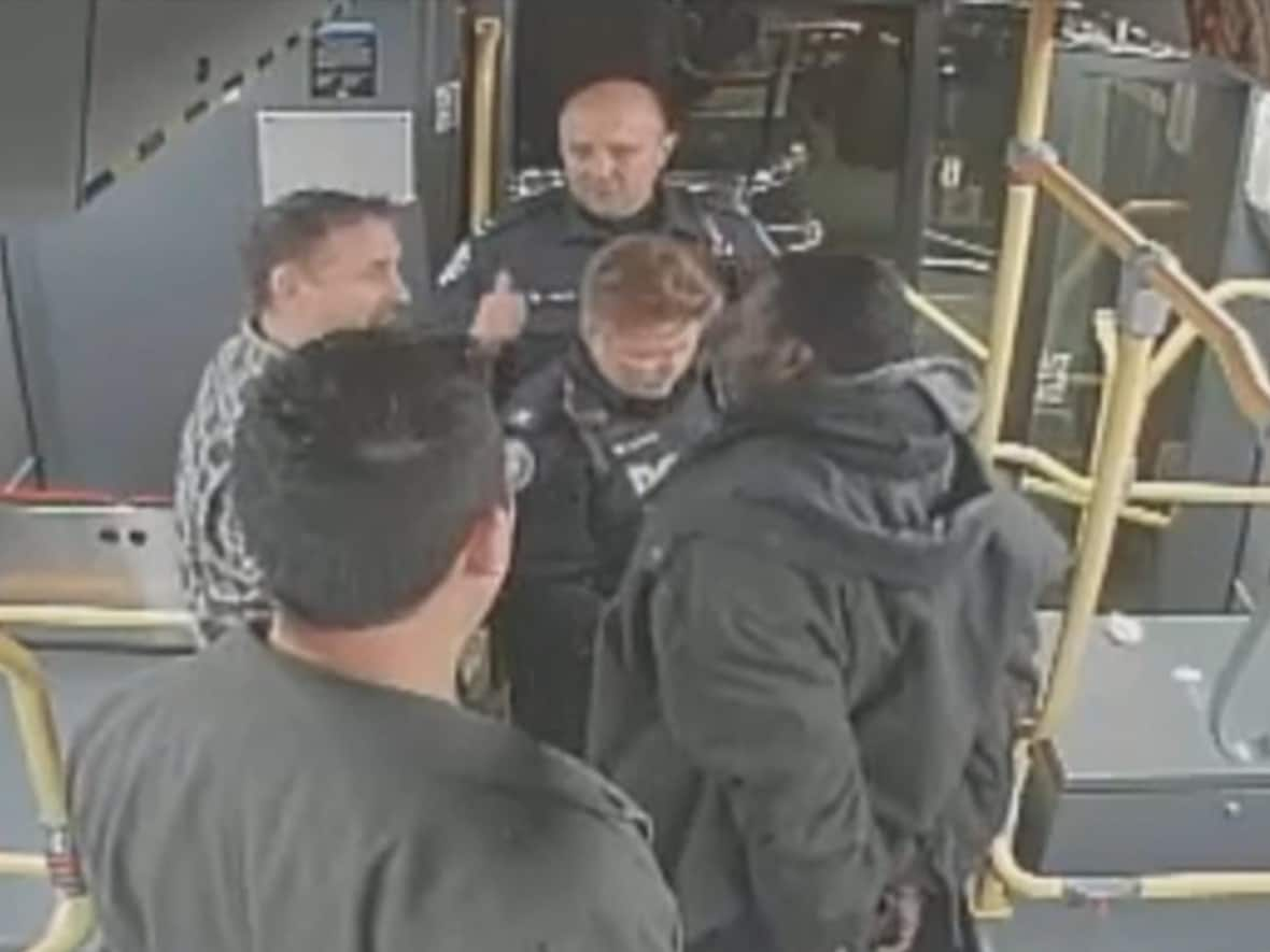 Surveillance video shows the arrest of Chase Richards by two plain-clothes Toronto police officers on a TTC bus on Dec. 13, 2019. (CBC - image credit)