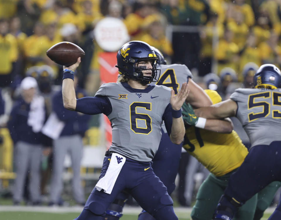 FILE - West Virginia quarterback Garrett Greene throws downfield against Baylor in the first half of an NCAA college football game, Saturday, Nov. 25, 2023, in Waco, Texas. West Virginia comes into the Duke's Mayo Bowl as the nation's fourth-best rushing team averaging 234.4 yard per game. Quarterback Greene is also a factor in the running game with 708 yards rushing and 13 TDs on the ground this season. (Rod Aydelotte/Waco Tribune-Herald via AP, File)