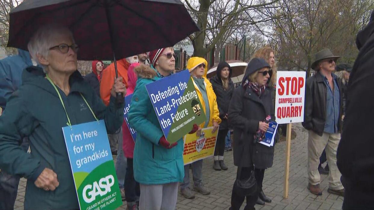 Dozens of people gathered in Milton on Saturday for a demonstration against a proposed quarry in the area.  (Martin Trainor/CBC - image credit)