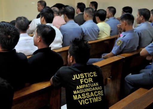 A man wears a protest T-shirt during the ongoing trial in Manila of the Ampatuans, a political clan accused of masterminding the country's worst massacre. Hearings are held just once a week and lawyers expect proceedings to drag on for years or even decades in the Philippines' backlogged justice system. Prosecutors have complained of delaying tactics by the defence