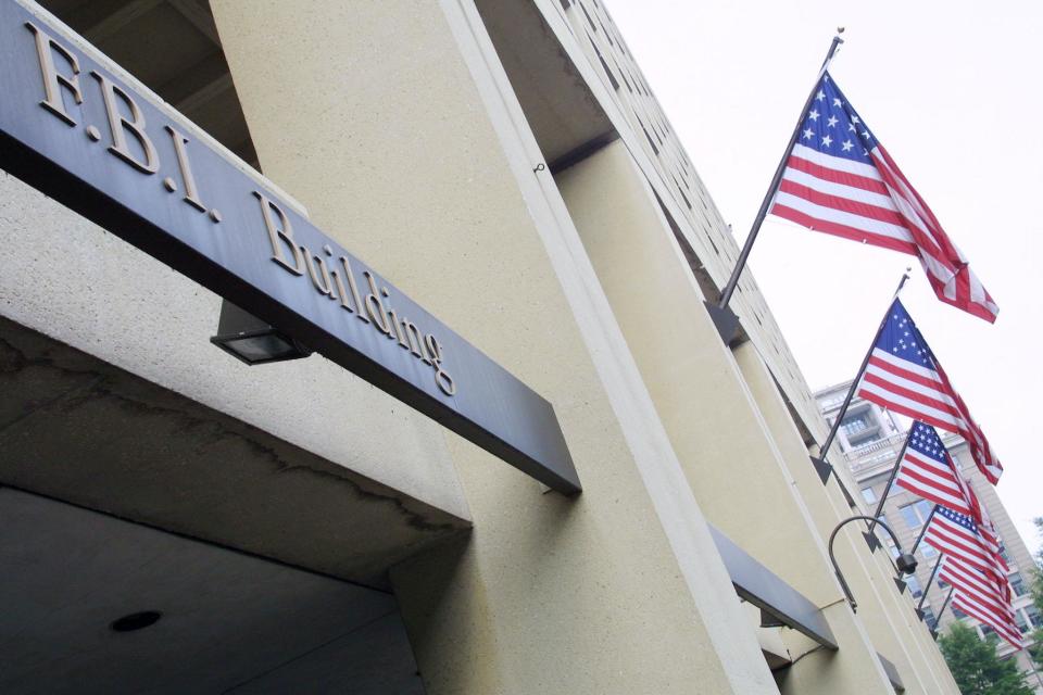 American flags fly over the Federal Bureau of Investigation (FBI) building July 18, 2001 in Washington, D. C: Alex Wong/Getty Images