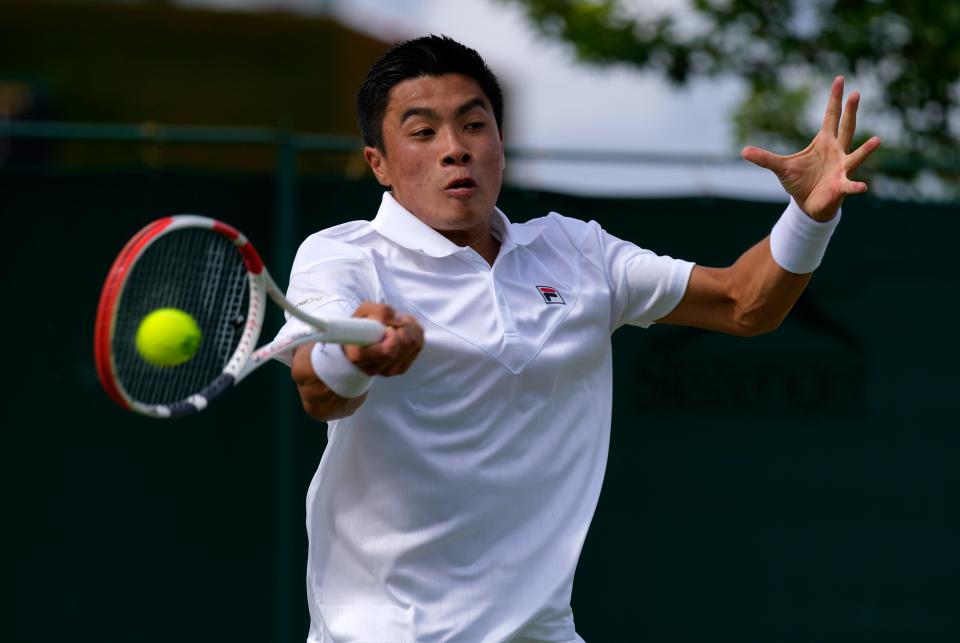 Brandon Nakashima returns to Denis Shapovalov in a second-round match.