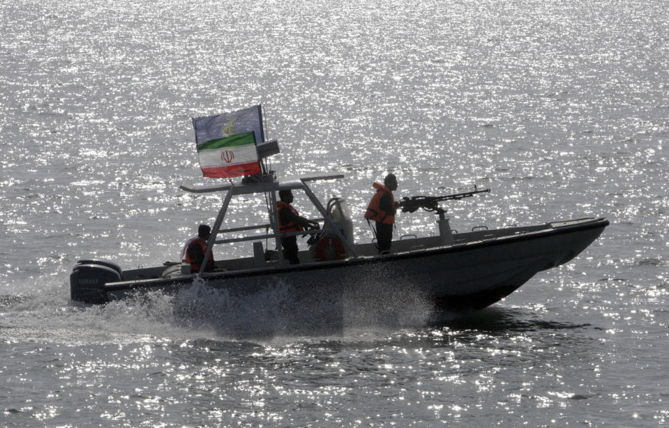 FILE - In this July 2, 2012 file photo, an Iranian Revolutionary Guard speedboat participates in a ceremony remembering the 290 passengers of an Iranian airliner which was downed by a U.S. warship in 1988, in Persian Gulf, Iran. On Monday, April 8, 2019, the Trump administration designated Iran’s Revolutionary Guard a “foreign terrorist organization” in an unprecedented move against a national armed force. Iran’s Revolutionary Guard Corps went from being a domestic security force with origins in the 1979 Islamic Revolution to a transnational fighting force. (AP Photo/Vahid Salemi, File)