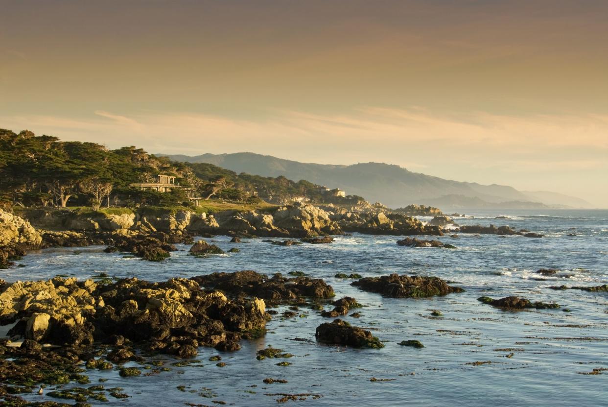 Sunset on the Coast in Carmel California as the fog rolls in off the Pacific Ocean