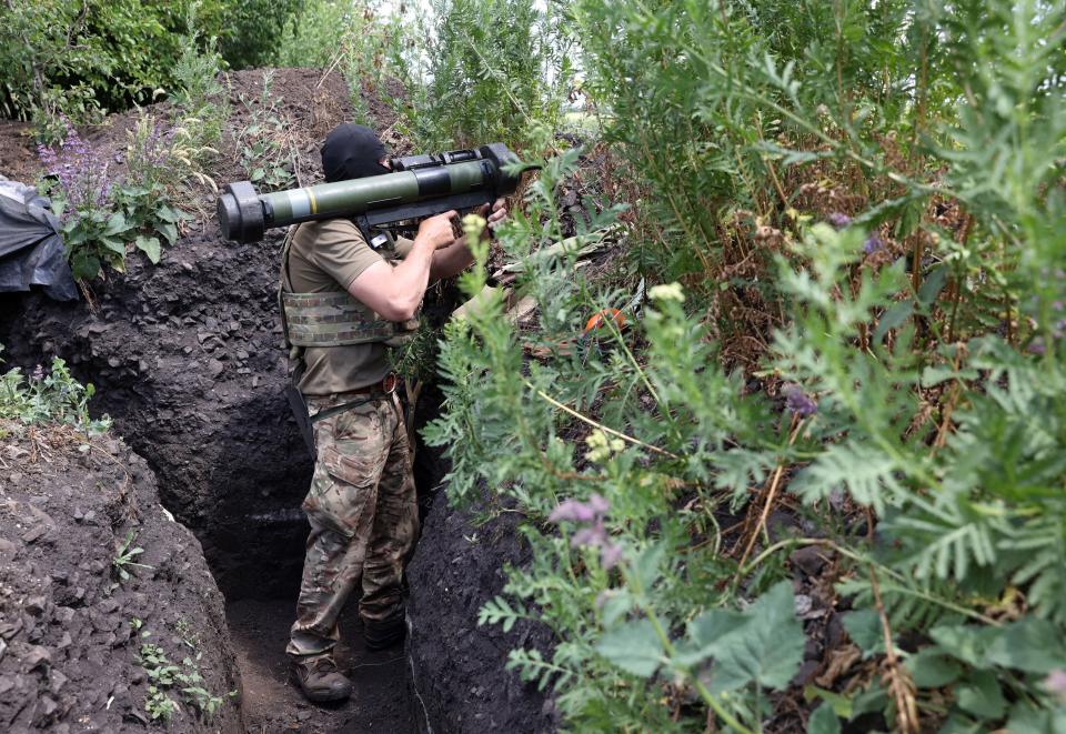 A Ukrainian serviceman mans a position in a trench on the front line near Avdiivka, Donetsk region on June 18, 2022 amid the Russian invasion of Ukraine.