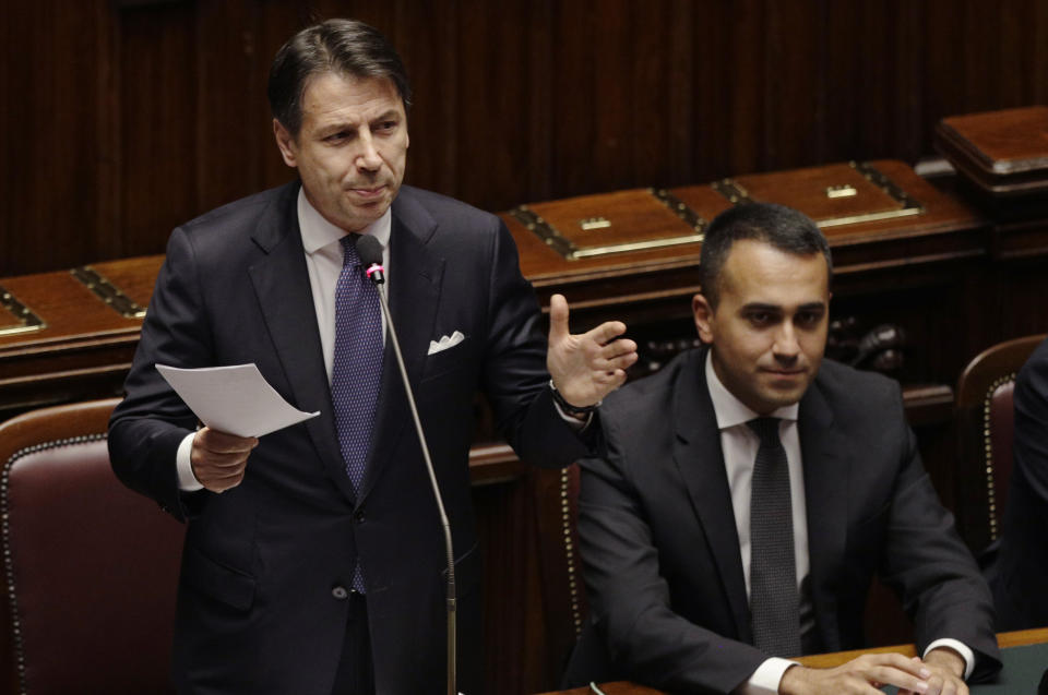 Italian Premier Giuseppe Conte, flanked by Foreign Minister Luigi Di Maio, intervenes in the parliament debate ahead of confidence vote later at the Lower Chamber in Rome, Monday, Sept. 9, 2019. Conte is pitching for support in Parliament for his new left-leaning coalition ahead of crucial confidence votes. (AP Photo/Gregorio Borgia)