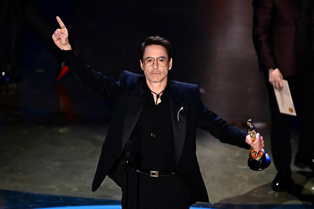 US actor Robert Downey Jr. accepts the award for Best Actor in a Supporting Role for 