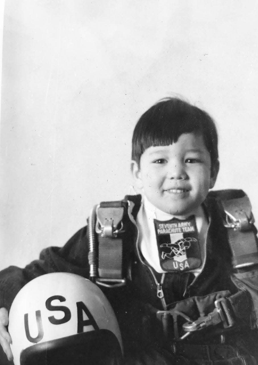 Kenneth Wasley, as a child, wears jump gear in a photo taken by his late father, Spec. 5 Michael Wasley, who was part of the Army Golden Knight's parachute demonstration team.