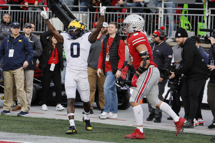 Michigan defensive back Mike Sainristil celebrates breaking up a pass against Ohio State tight end Cade Stover during the second half of an NCAA college football game on Saturday, Nov. 26, 2022, in Columbus, Ohio. (AP Photo/Jay LaPrete)