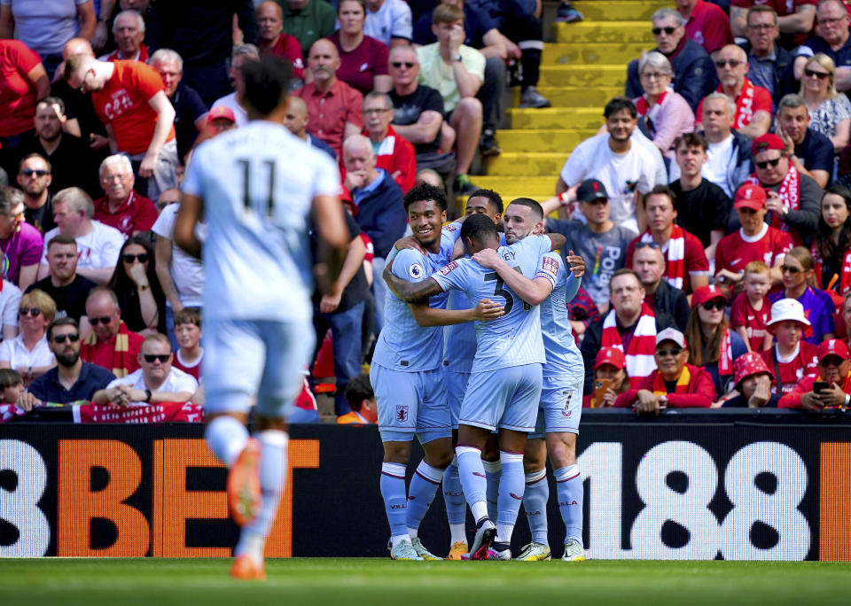 Aston Villa players celebrate after Jacob Ramsey scores his side's first goal of the game, during the English Premier League soccer match between Liverpool and Aston Villa, at Anfield stadium, Liverpool, England, Saturday May 20, 2023. (Peter Byrne/PA via AP)