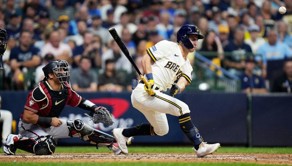 Milwaukee Brewers center fielder Sal Frelick (10) singles on a ground ball to Arizona Diamondbacks starting pitcher Brandon Pfaadt (32) and is deflected by Arizona Diamondbacks catcher Gabriel Moreno (14) during the third inning of the wildcard playoff game on Tuesday October 3, 2023 at American Family Field in Milwaukee, Wis.