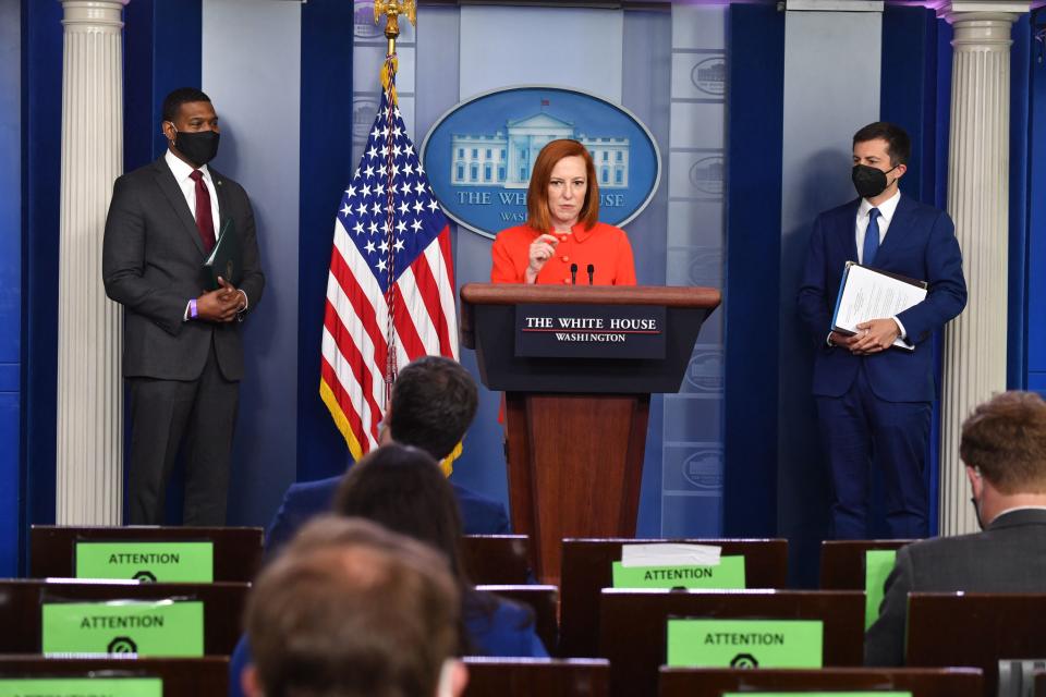 White House press secretary Jen Psaki, with Environmental Protection Agency administrator Michael Regan, left, and Transportation Secretary Pete Buttigieg, at a press briefing on Wednesday. (Nicholas Kamm/AFP via Getty Images)