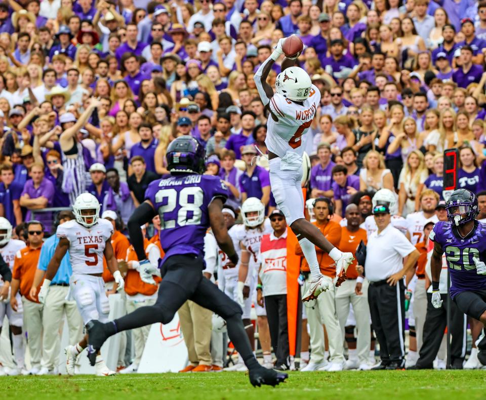 Texas wide receiver Xavier Worthy, leaping for a catch against TCU in 2021, is being projected as a first-round pick in next year's NFL draft, but his size could be a problem.