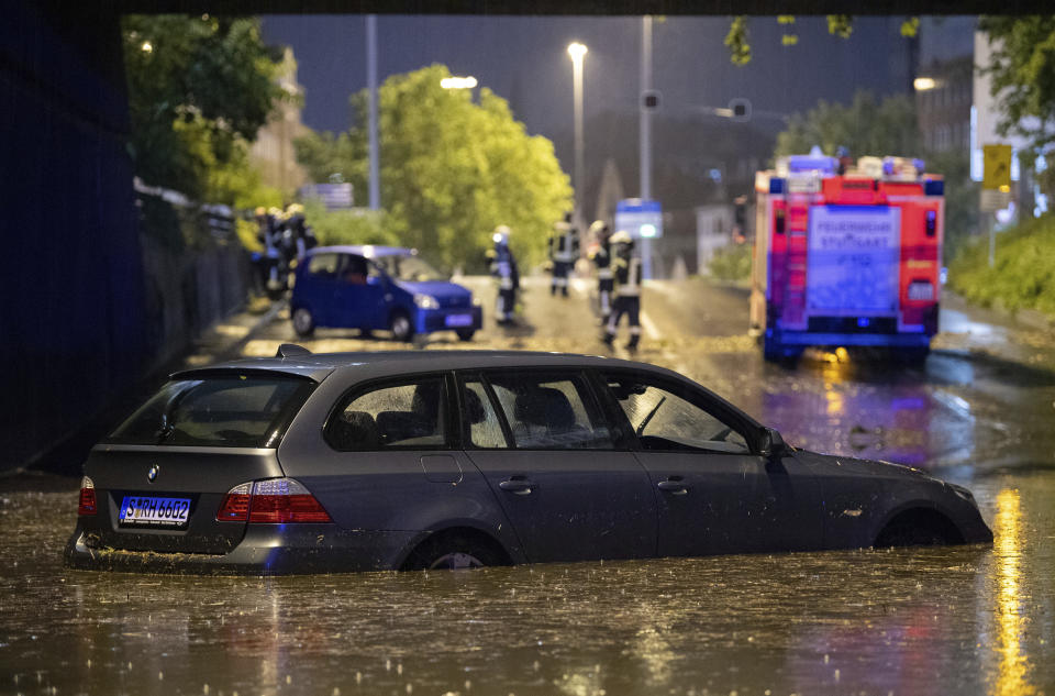 A car stands in the flooded car underpass in Stuttgart, Germany, Monday, June 28, 2021. Thunderstorms hit Germany late Monday and torrential rains poured down on the southern and western parts of the country leading to dozens of accidents and hundreds of firefighter operations throughout the night.(Marijan Murat/dpa via AP)