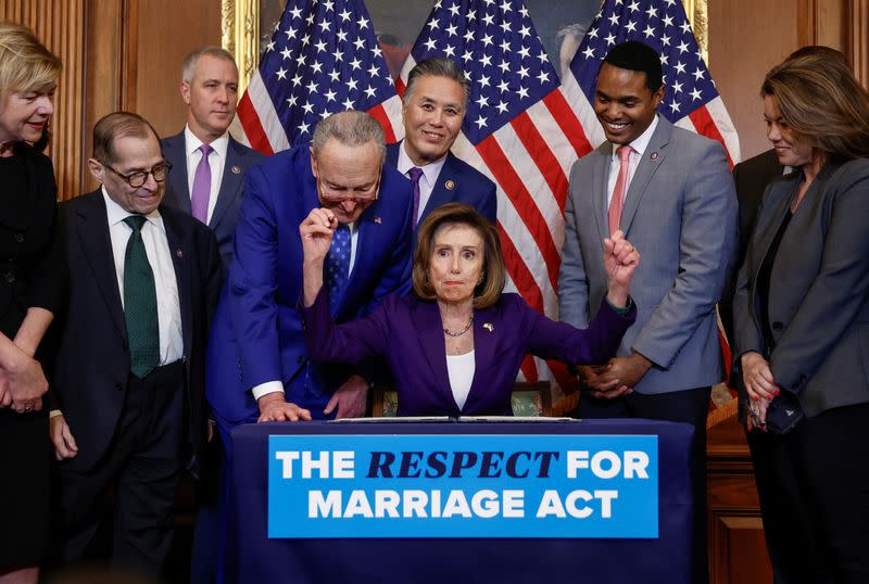 U.S. House Speaker Nancy Pelosi signs "The Respect for Marriage Act" on Capitol Hill