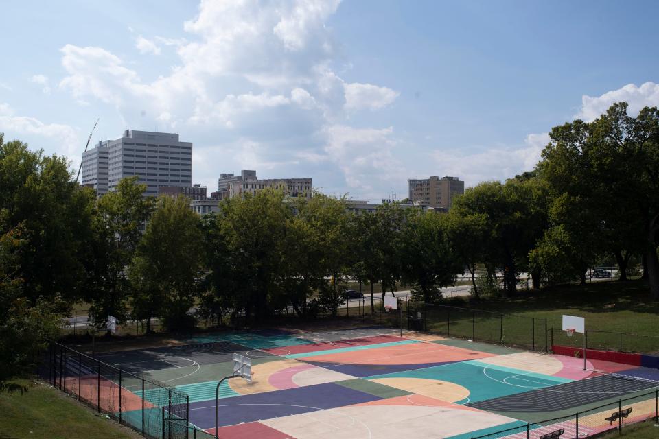 From the basketball courts at the Cal Johnson Community Center, the downtown Knoxville skyline is visible on the other side of the James White Parkway.