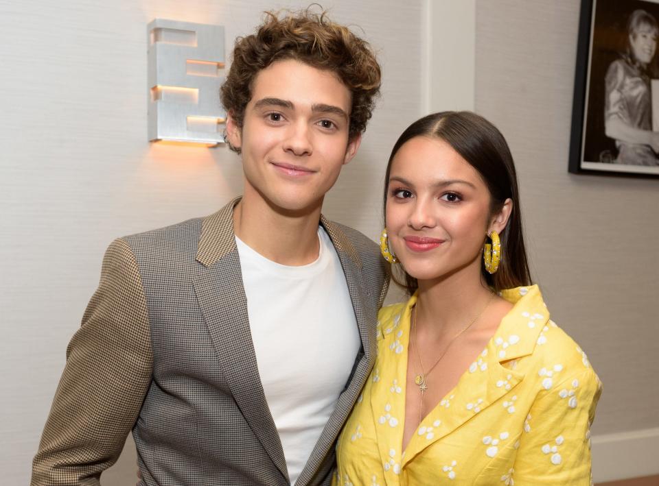 Joshua and Olivia pose together at an event