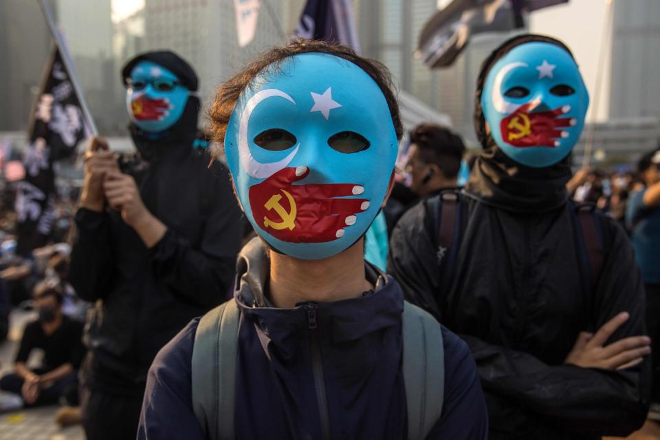 Protesters attend a rally in Hong Kong to show support for the UighursAFP/Getty