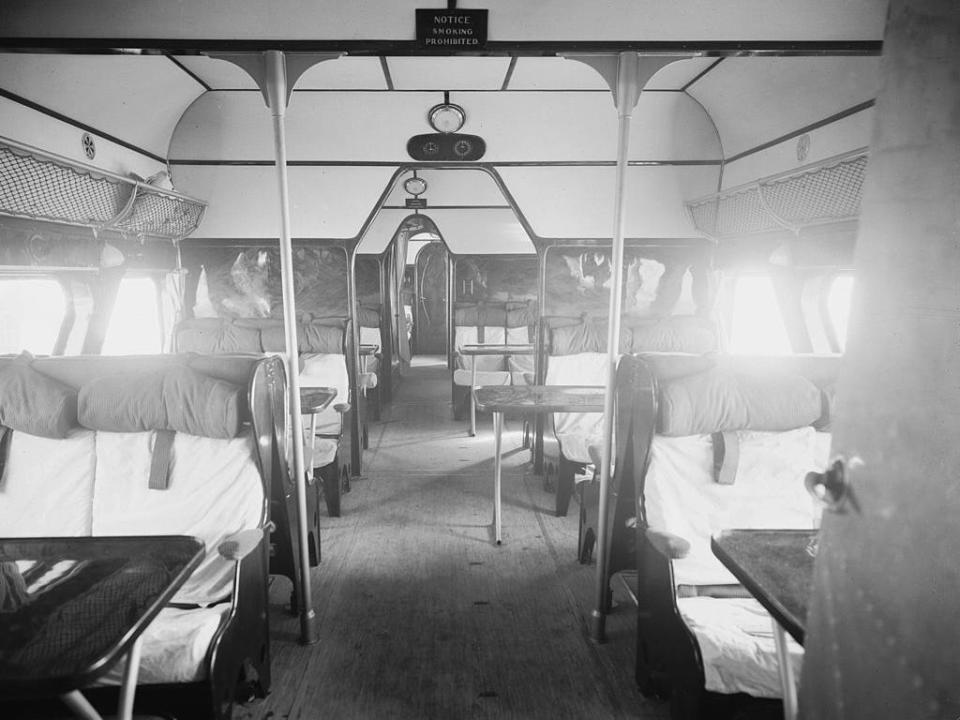 The interior of a train carriage circa 1934.