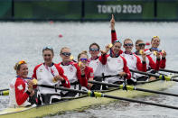 Lisa Roman, Kasia Gruchalla-Wesierski, Christine Roper, Andrea Proske, Susanne Grainger, Madison Mailey, Sydney Payne, Avalon Wasteneys and Kristen Kit of Canada celebrate winning the gold medal in the women's rowing eight final at the 2020 Summer Olympics, Friday, July 30, 2021, in Tokyo, Japan. (AP Photo/Lee Jin-man)