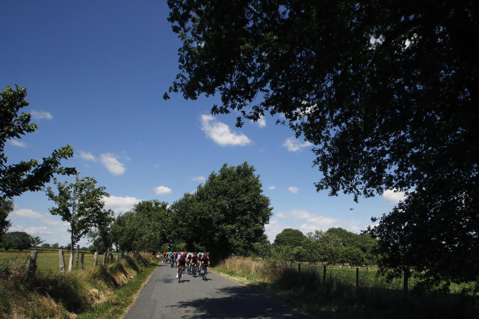 The pack rides during the tenth stage of the Tour de France cycling race over 217 kilometers (135 miles) with start in Saint-Flour and finish in Albi, France, Monday, July 15, 2019. (AP Photo/ Christophe Ena)