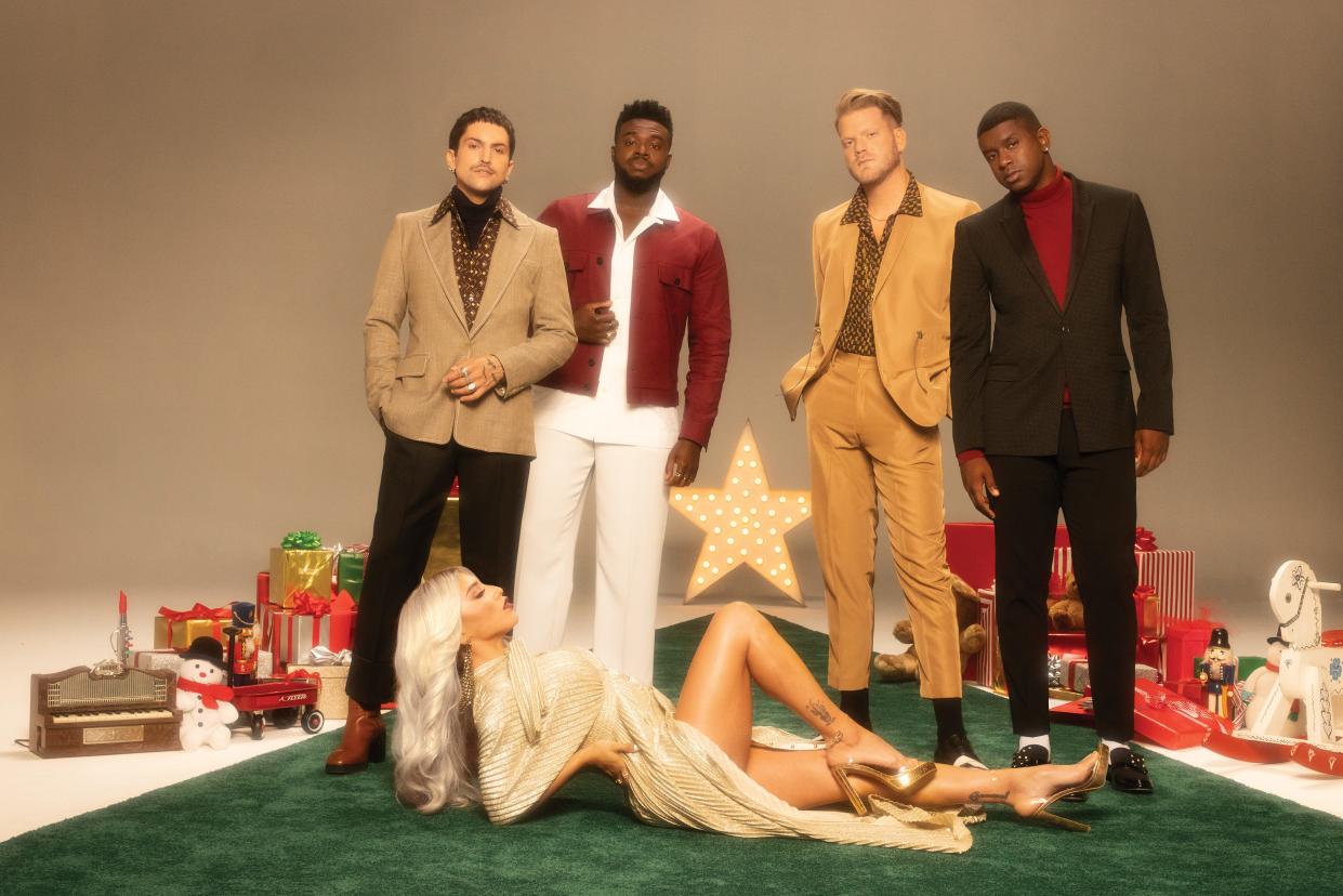 Members of Pentatonix, from left: Mitch Grassi, Kevin Olusola, Scott Hoying and Matt Salle. Kirstin Maldonado in the foreground.