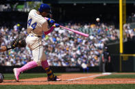 Seattle Mariners' Julio Rodríguez hits a double against the Oakland Athletics during the fifth inning of a baseball game Sunday, May 12, 2024, in Seattle. (AP Photo/Lindsey Wasson)