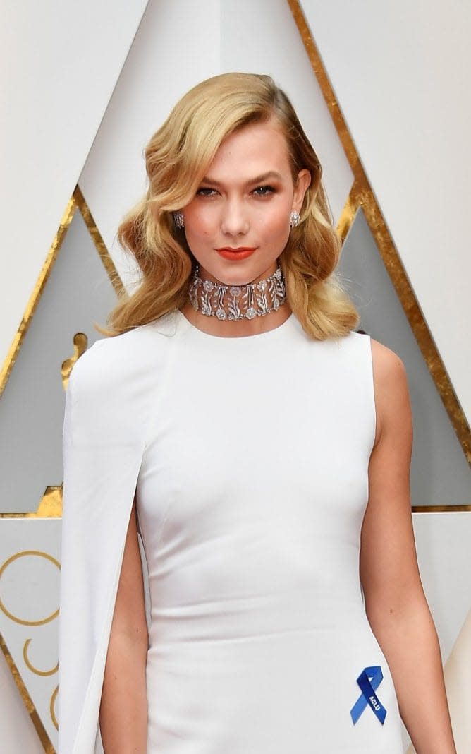 Karlie Kloss wears an ACLU blue ribbon at the 2017 Academy Awards - Getty Images