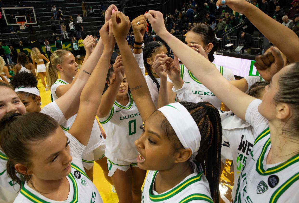 The Oregon women’s team comes together at mid court after defeating Northern Arizona to start their 2023-24 season at Matthew Knight Arena on Nov 6, 2023 in Eugene.