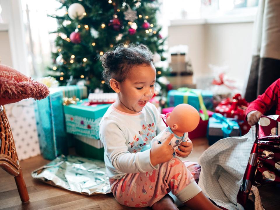 Girl playing with doll