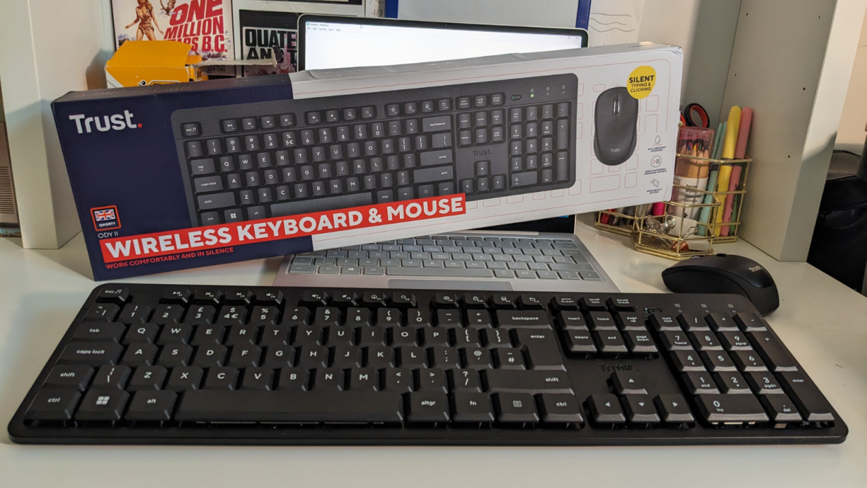  Trust Ody II Silent Wireless Keyboard and mouse on a desk with box in background. 