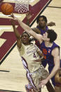 Florida State guard Caleb Mills has his layup attempt tipped by Clemson center PJ Hall in the first half of an NCAA college basketball game in Tallahassee, Fla., Saturday, Jan. 28, 2023. (AP Photo/Phil Sears)